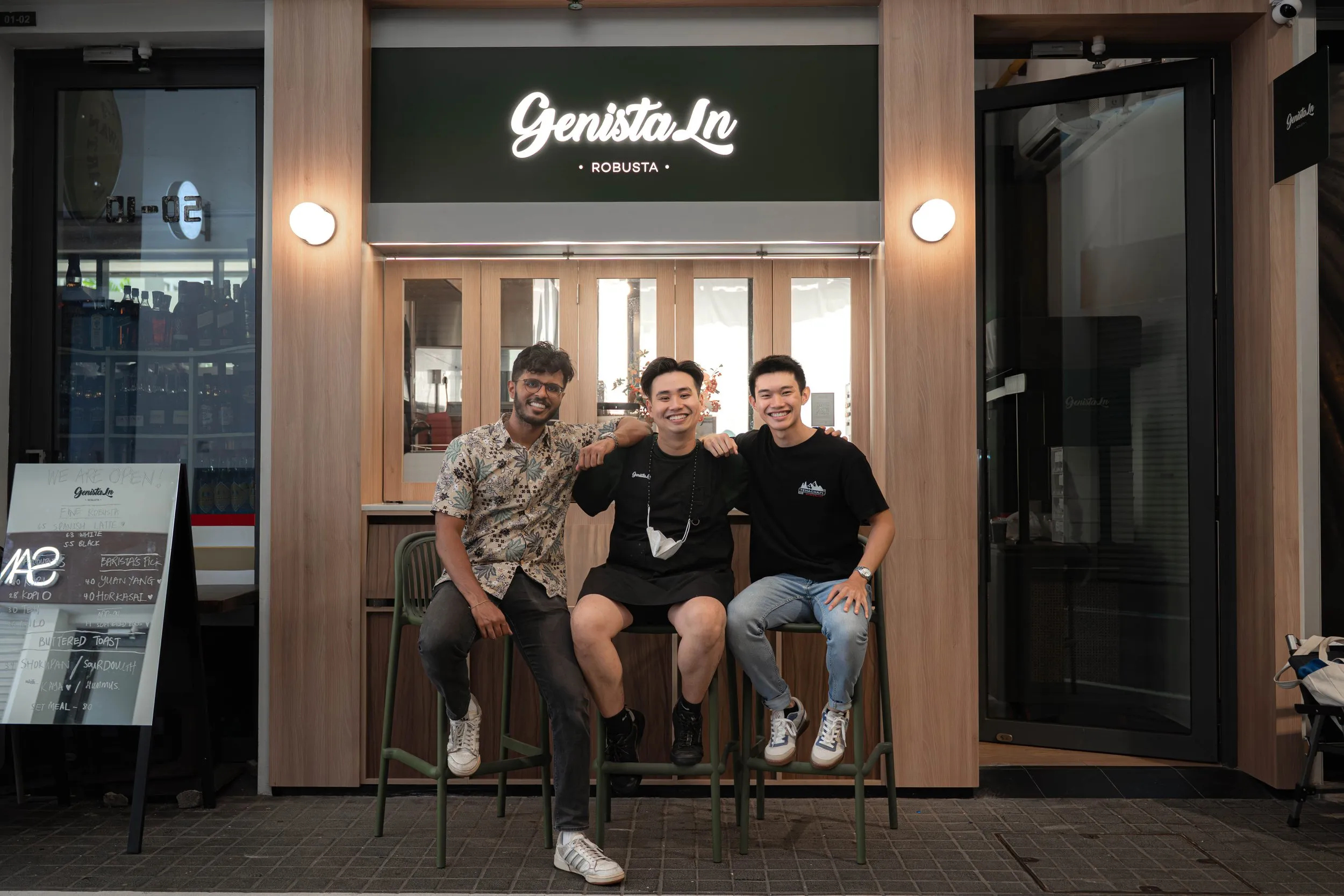 The founders of Genista Ln behind the kopi cart