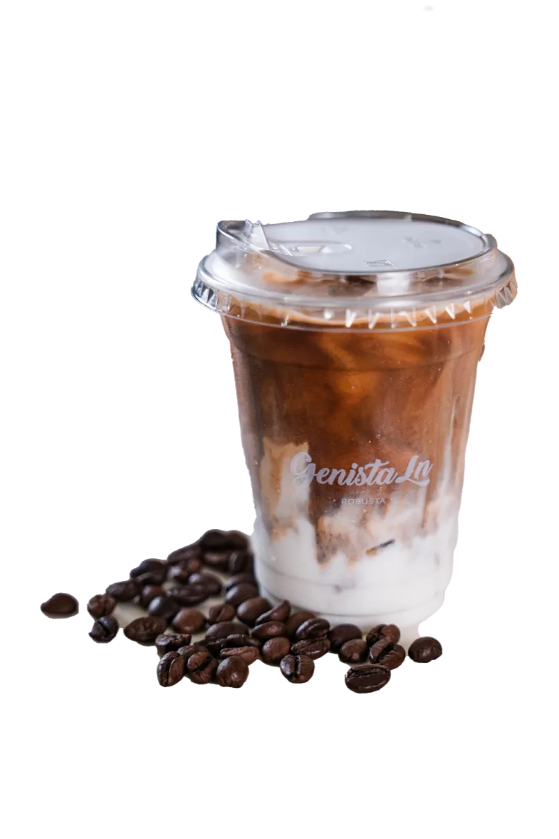 Iced Genista Ln Spanish Latte with layers of coffee and milk, beside coffee beans