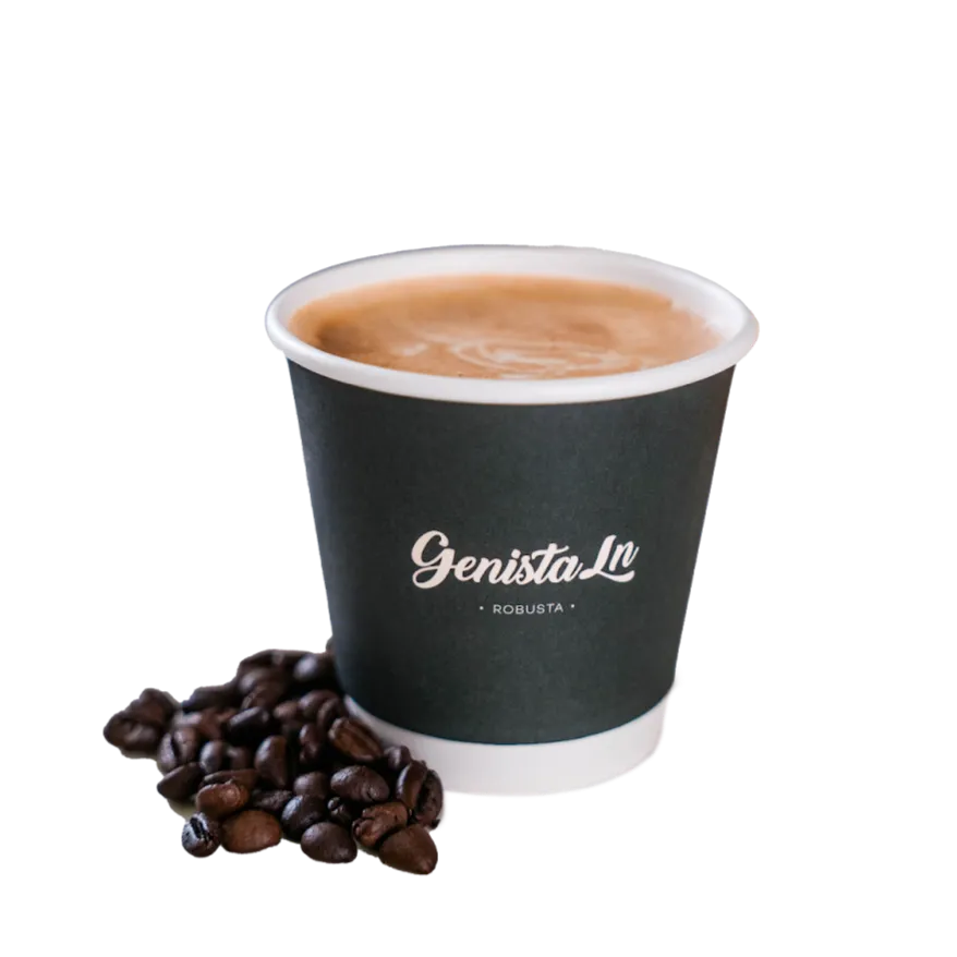A hot Fine Robusta White coffee in a Genista Ln cup, beside coffee beans